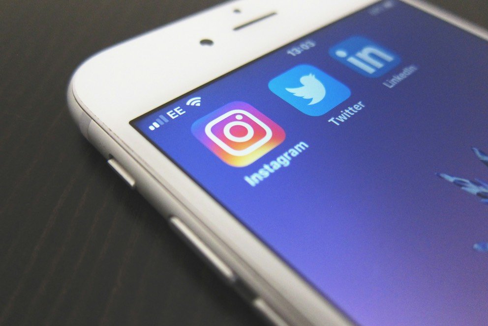How to Develop Your Personal Brand as a Software Professional 3 Social Media Icons on a Phone