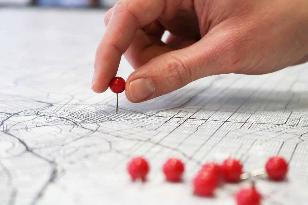 Software Engineer Hand Adding Pin on Map