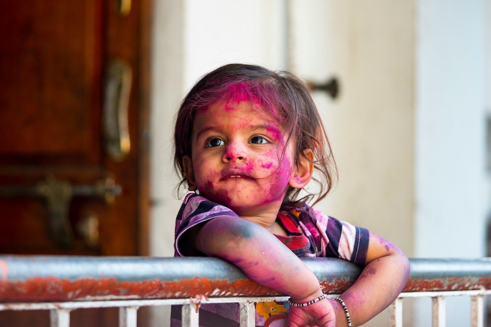 Code Without Borders: Cultural Differences in Tech Workspaces 3 Indian Kid Holi Colors