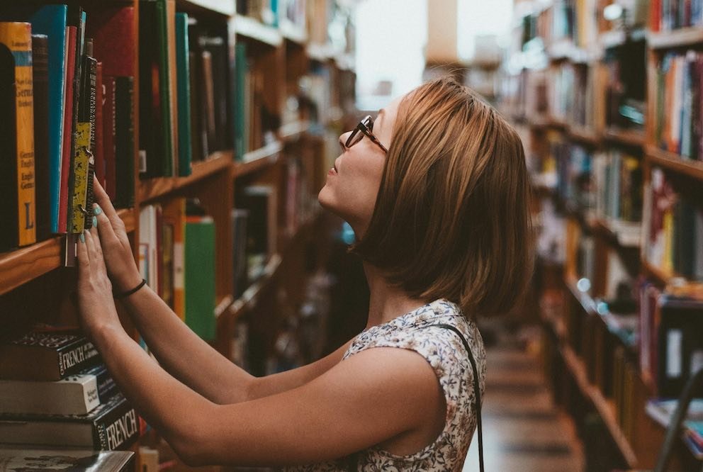 Navigating the Maze of Documentation Updates with Version Control 2 Engineer Lost in Library Looking at Books